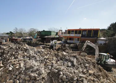 April construction update for PAW Patrol at Chessington: diggers with piles of rubble demolishing old Mexicana buildings