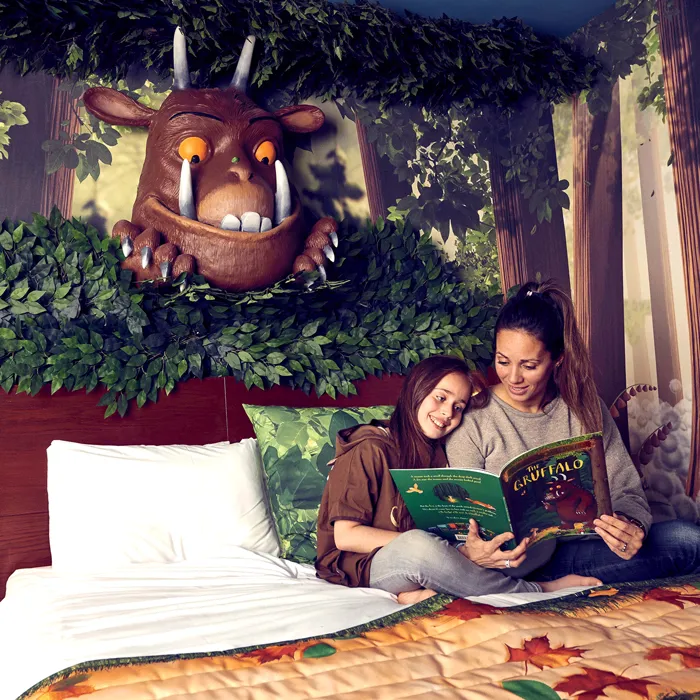 Mother and Daughter reading in a Gruffalo hotel room in the Chessington Safari Hotel