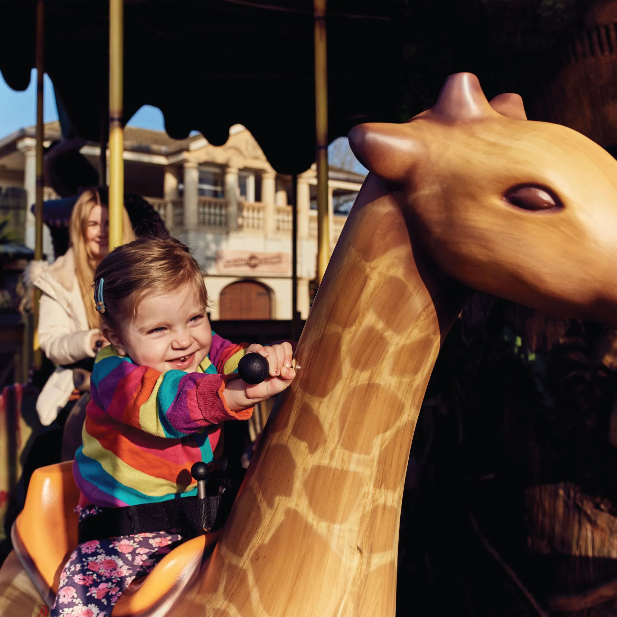 Young girl on the Adventure Tree Carousel