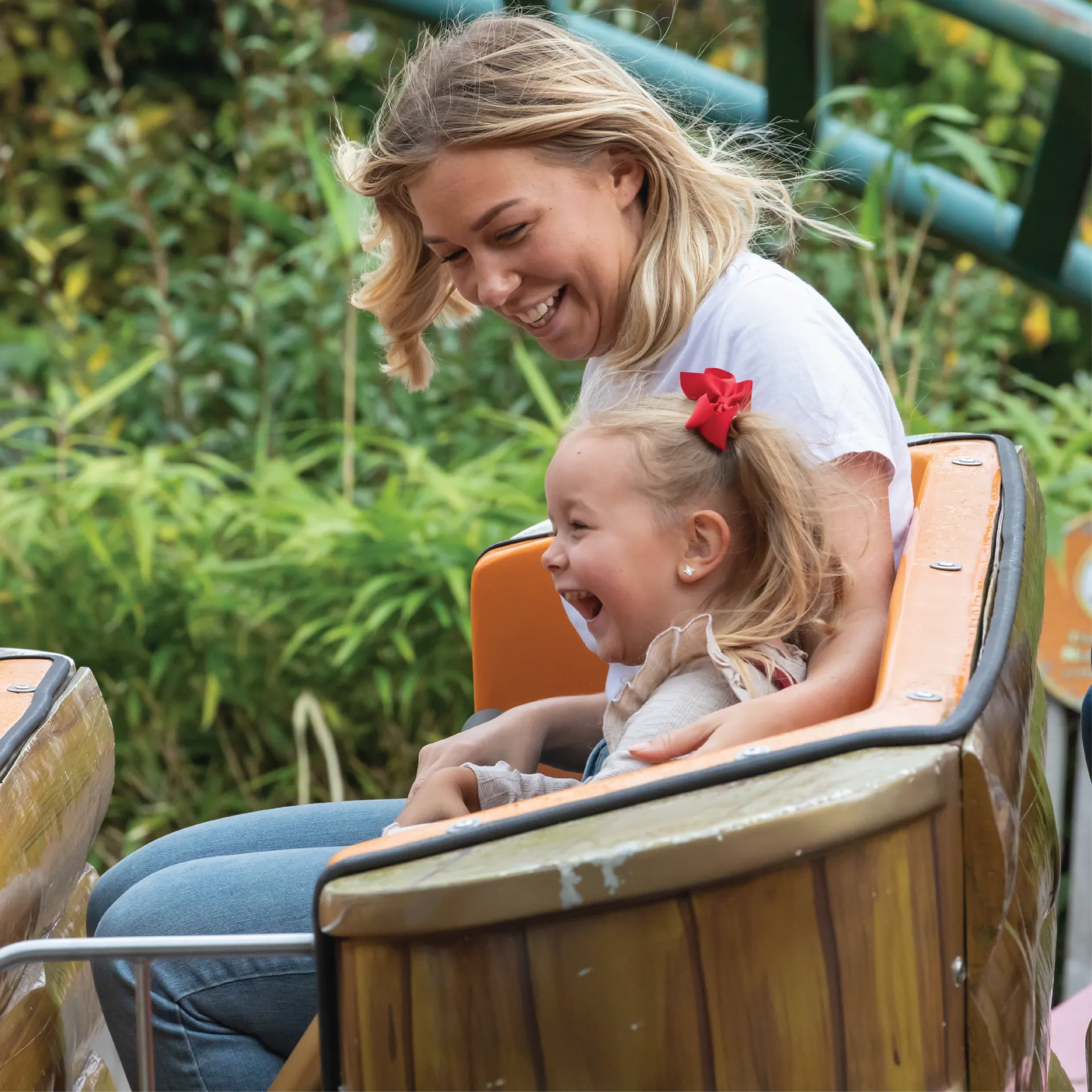 Adult and child on Griffin's Galleon ride at Chessington World of Adventures Resort