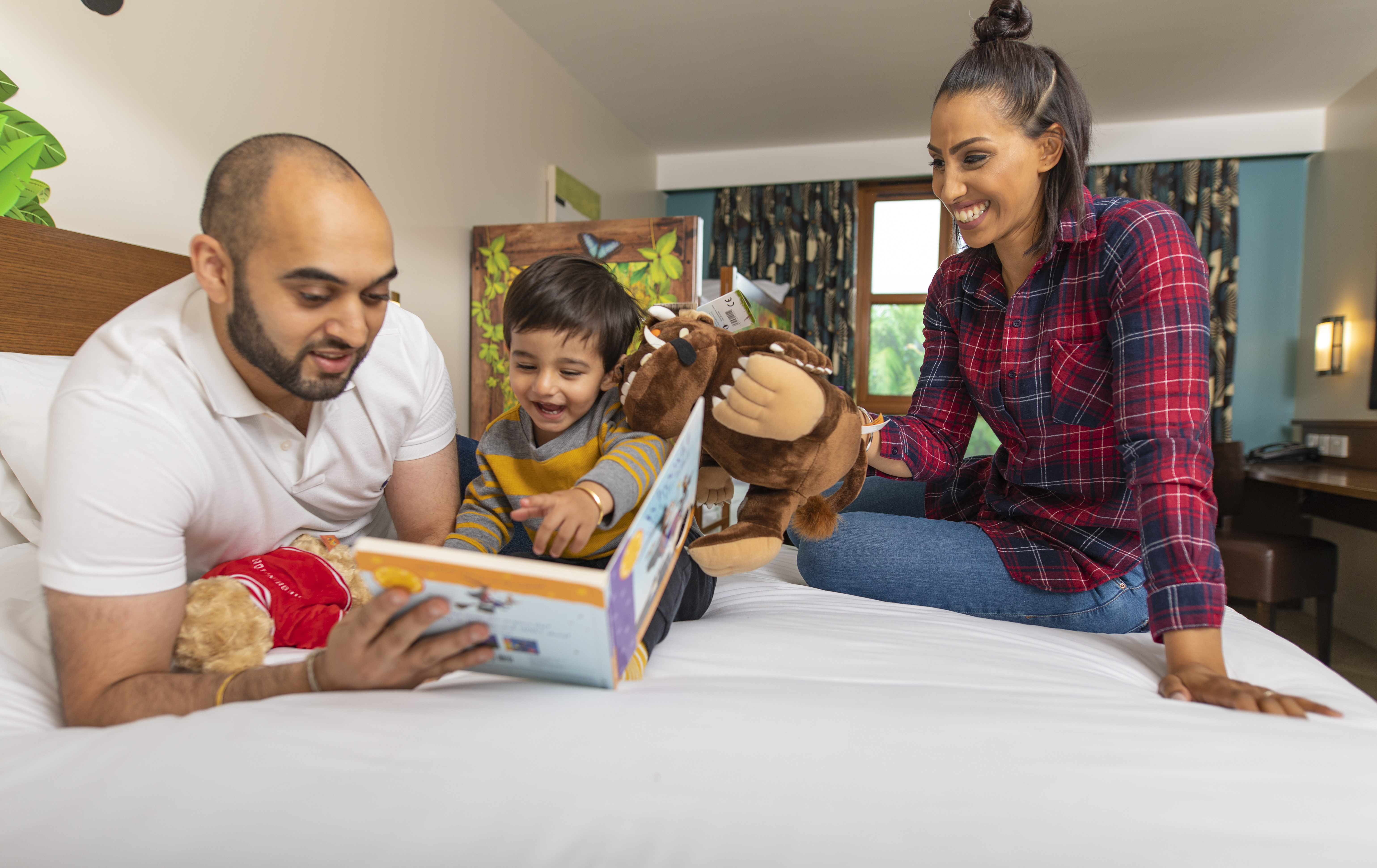 Room 1 Family reading book with Gruffalo toy